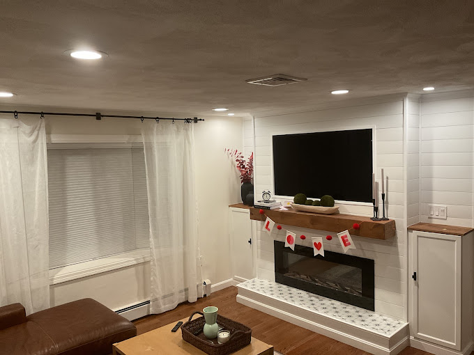 A living room filled with furniture and a flat screen tv